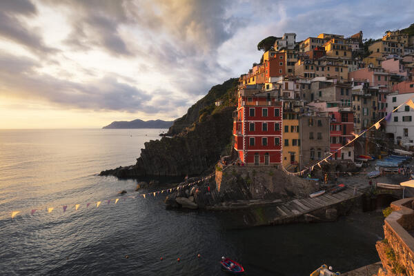 Sunset over the village of Riomaggiore, National Park of Cinque Terre, municipality of Riomaggiore, La Spezia province, Liguria district, Italy, Europe

