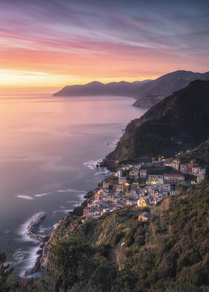 Spectacular sunset over the village of Riomaggiore, National Park of Cinque Terre, municipality of Riomaggiore, La Spezia province, Liguria district, Italy, Europe
