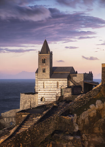 The last lights of the sunset on the Church of San Pietro, Portovenere, La Spezia province, Liguria, Italy, Europe