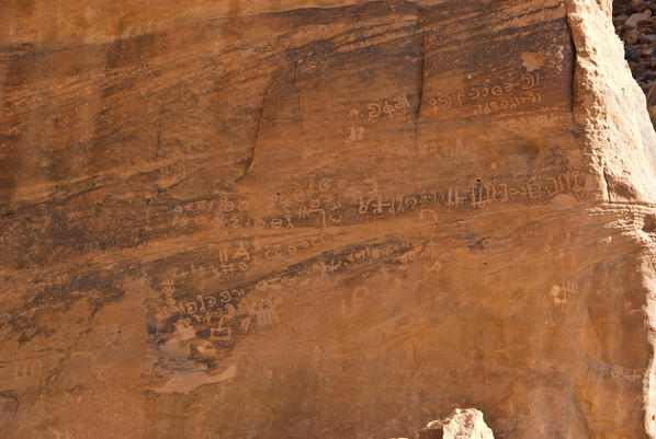 Ancient inscriptions tamudiche on the sandstone rock in the Wadi Rum desert, Jordan