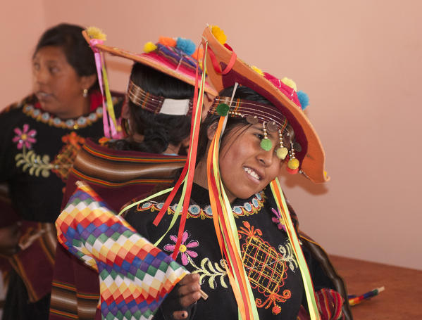 Young Aymara girl dressed with the typical costume. Aymaras are the native population of the Titicaca Lake area, in Bolivia, South America.