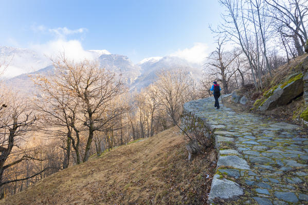 Hiker on the muletrack, Arnad, Vallon de Va, Aosta Valley, Italian alps, Italy