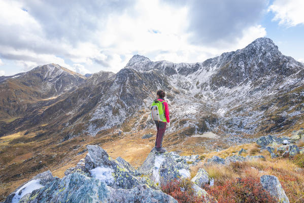 Hiker on the ridge of Rocca Maunero, Locana, Valle dell Orco, Province of Turin, Graian alps, Piedmont, Italy