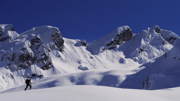 Skier with a huge amount of fresh snow, Valgerola, Valtellina, Lombary, Italy