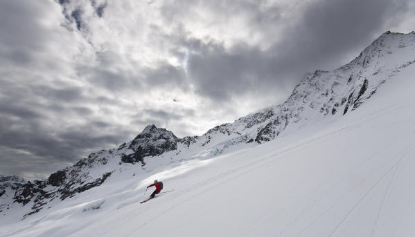 Skier on Disgrazia glacier, Valmalenco, Valtellina, Lombardy, Italy