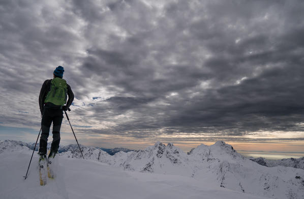 A skier in an arctic-like light, Pizzo Tre Signori group, Valgerola, Valtellina, Lombardy, Italy