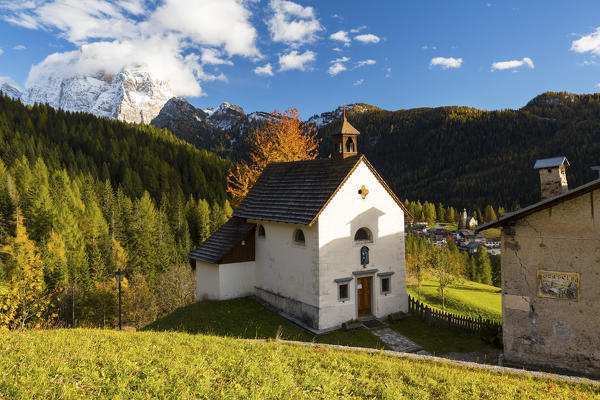 San Osvaldo church with Monte Pelmo in the background. Val Fiorentina, Veneto, Italy.