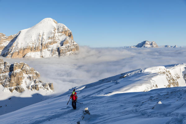 Photographer on the top of Piccolo Lagazuoi. On the background Tofana di Rozes. Cortina d'Ampezzo, Belluno province, Veneto, Italy.