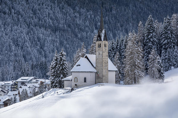 Blessed Virgin of Health church in winter, Caviola, municipality of Falcade, Biois valley, Belluno, Veneto, Italy