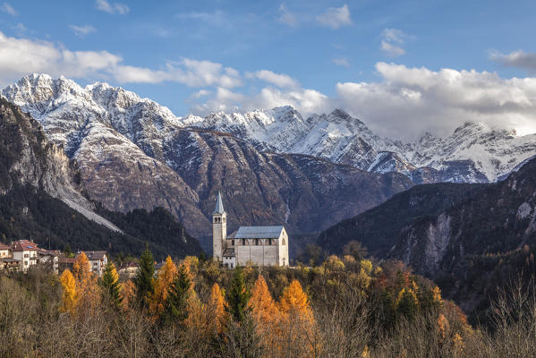 Ancient church of  Valle di Cadore and snowcapped Dolomiti di Oltrepiave on the background, Belluno, Veneto, Italy, Europe