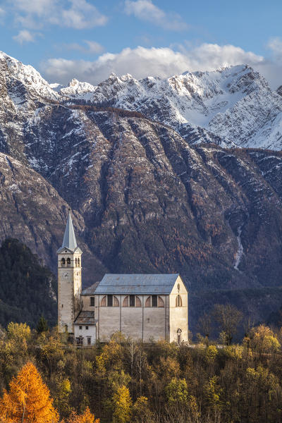 Ancient church of  Valle di Cadore and snowcapped Dolomiti di Oltrepiave on the background, Belluno, Veneto, Italy, Europe