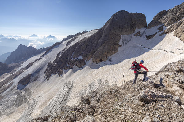 hiker on the short via ferrata between Punta Penia and the glacier, Marmolada, Marmolada, marmolada glacier, Trentino alto Adige, Dolomites, Italy