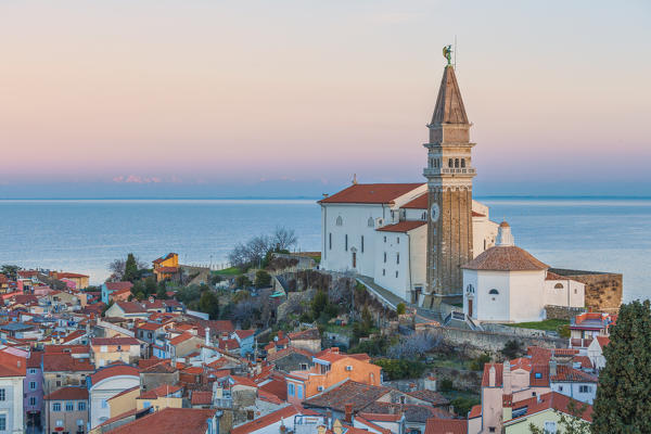 Twilight on the historic town of Piran with the church of St. George, Primorska, Istria, Slovenia