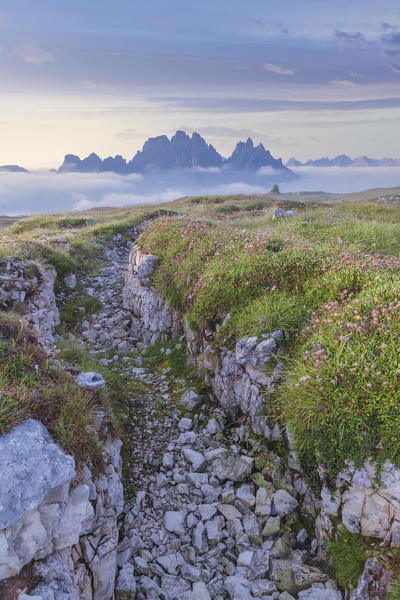 trench on the Monte Piana, sunrise towards the Cadini di Misurina, Sexten Dolomites, Auronzo di Cadore, Belluno, Veneto, Italy