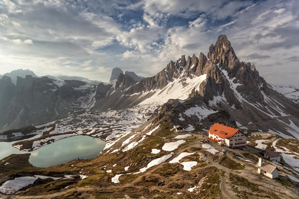 The refuge ANTONIO Locatelli - S. Innerkofler - DREIZINNENHÜTTE and Mount Paterno. In the valley below the beautiful lakes of Piani (Bödenseen), in a dawn of early summer. Dolomites, Italy