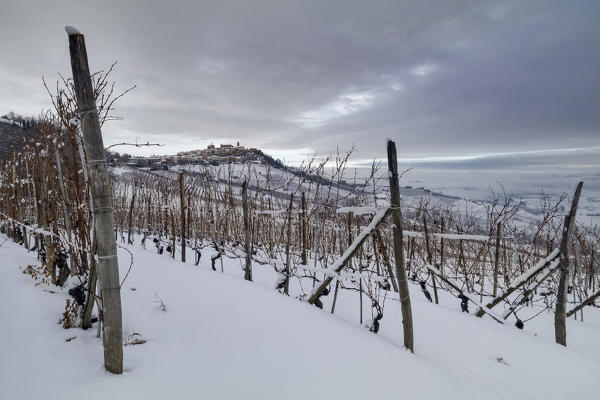 Langhe, Cuneo district, Piedmont, Italy. Langhe wine region winter snow, La Morra village
