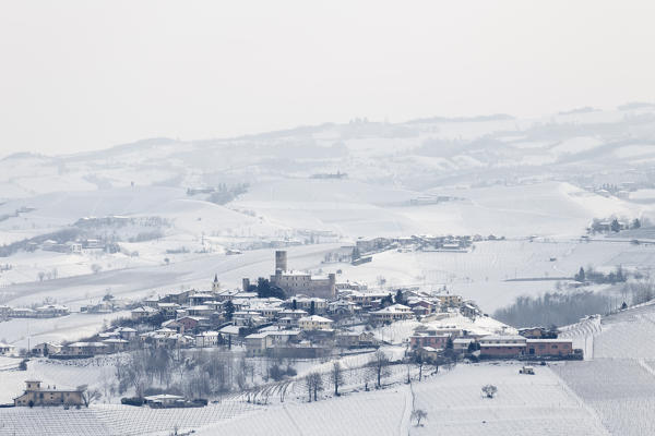 Langhe, Cuneo district, Piedmont, Italy. Langhe wine region winter snow, Castiglione Falletto castle
