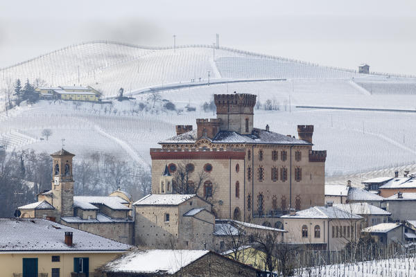 Langhe, Cuneo district, Piedmont, Italy. Langhe wine region winter snow, Barolo castle
