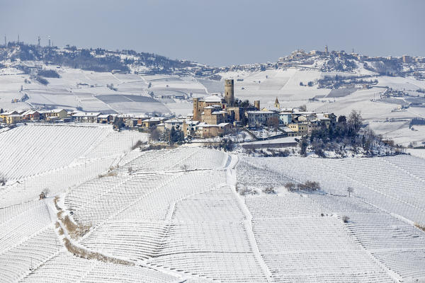 Langhe, Cuneo district, Piedmont, Italy. Langhe wine region winter snow, Castiglione Falletto castle