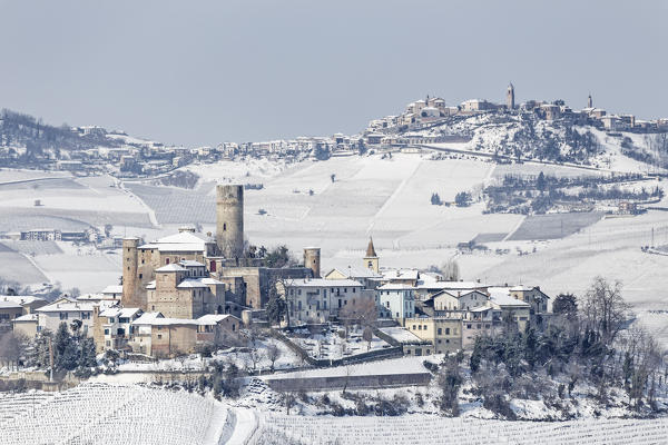 Langhe, Cuneo district, Piedmont, Italy. Langhe wine region winter snow, Castiglione Falletto castle