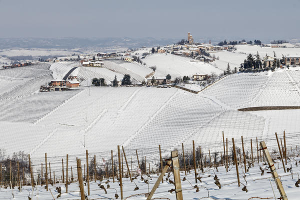 Langhe, Cuneo district, Piedmont, Italy. Langhe wine region winter snow, Serralunga d’Alba castle