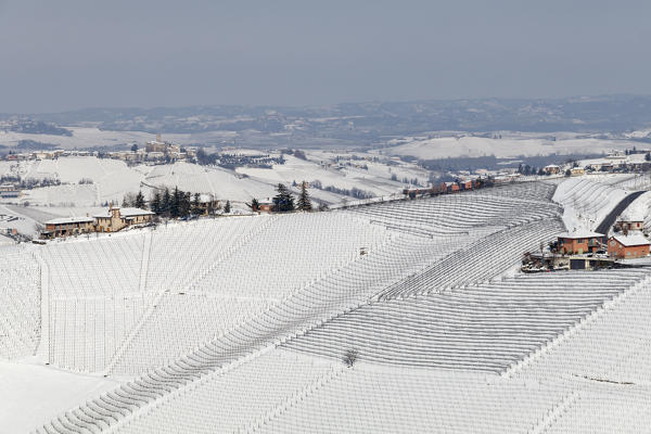 Langhe, Cuneo district, Piedmont, Italy. Langhe wine region winter snow, Serralunga d’Alba castle