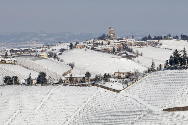 Langhe, Cuneo district, Piedmont, Italy. Langhe wine region winter snow, Serralunga d’Alba castle