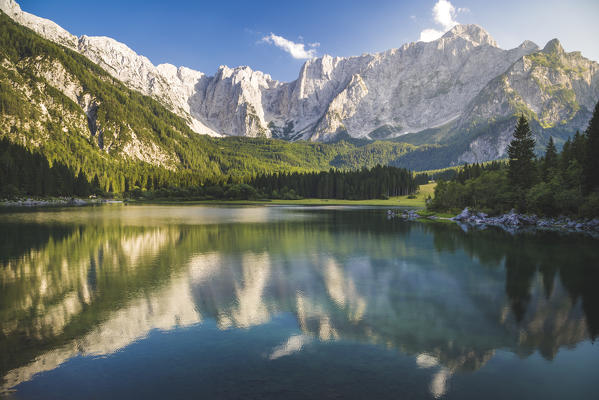 Superior Fusine Lake with Mount Mangart on the background. Fusine Lakes Natural Park, Tarvisio, Udine province, Friuli Venezia Giulia, Italy.