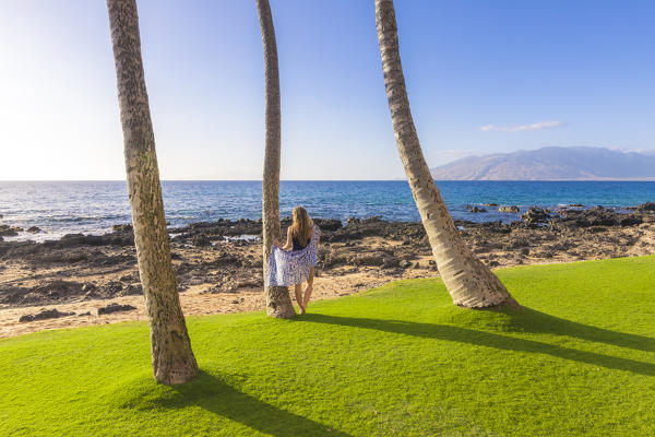 A girl enjoing the sun in Maui, near Makena beach, Maui island, Hawaii, USA