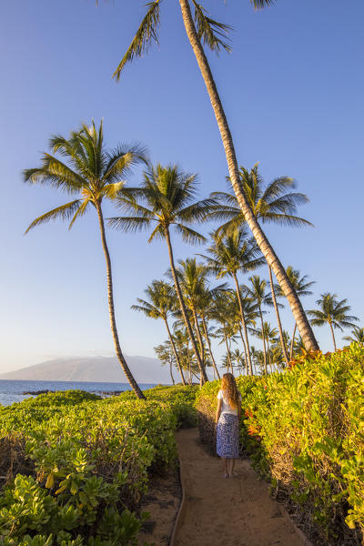 A girl enjoing the sun in Maui, near Makena beach, Maui island, Hawaii, USA