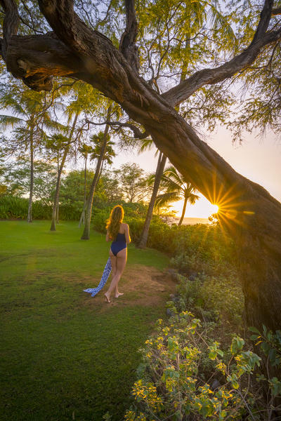 A girl enjoing the sun in Maui, near Makena beach, Maui island, Hawaii, USA