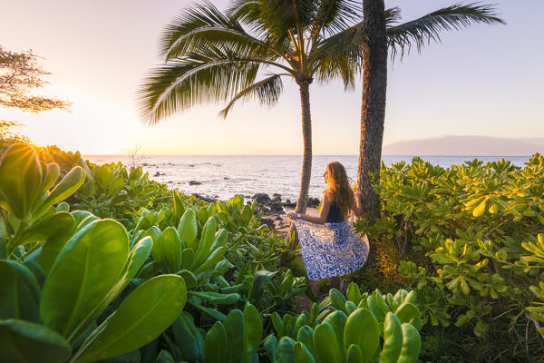 A girl enjoing the sun in Maui, near Makena beach, Maui island, Hawaii, USA