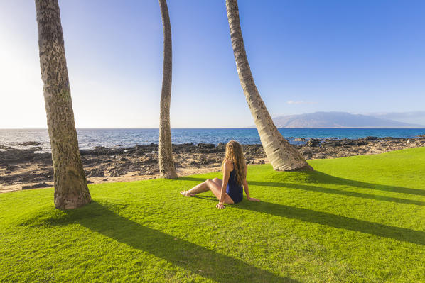 A girl enjoing the sun in Maui, near Makena beach, Maui island, Hawaii, USA 