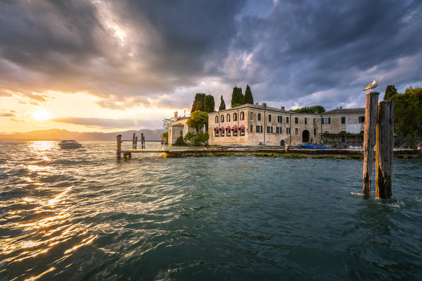 The sunset at Punta San Vigilio, an historic Pope residence on the eastern side of Garda Lake. Punta San Vigilio, Garda Lake, Veneto, Italy