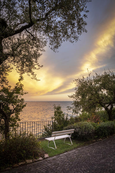 Western side of Garda lake during a cloudy sunset. Toscolano Maderno, Brescia Province, Lombardy, Italy