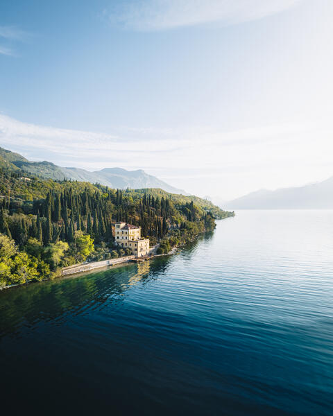 Aerial view of a yellow villa near Toscolano Maderno, Lombardy, Garda Lake, Italy.