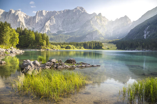 Superior Fusine Lake with Mount Mangart on the background. Fusine Lakes Natural Park, Tarvisio, Udine province, Friuli Venezia Giulia, Italy.