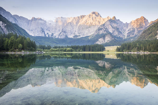 Superior Fusine Lake with Mount Mangart on the background. Fusine Lakes Natural Park, Tarvisio, Udine province, Friuli Venezia Giulia, Italy.