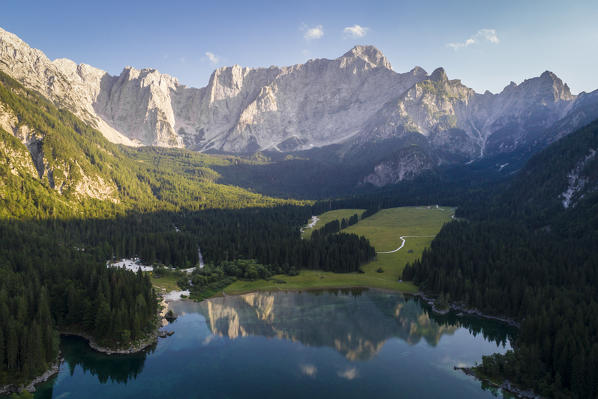 Aerial view of superior Fusine Lake with Mount Mangart on the background. Fusine Lakes Natural Park, Tarvisio, Udine province, Friuli Venezia Giulia, Italy.