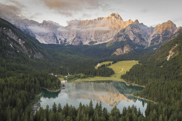 Aerial view of superior Fusine Lake with Mount Mangart on the background. Fusine Lakes Natural Park, Tarvisio, Udine province, Friuli Venezia Giulia, Italy.