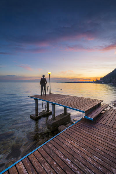 A pier near Toscolano Maderno village, on Garda Lake. Brescia Province, Lombardy, Italy