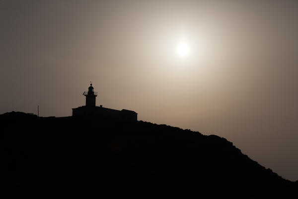 foto  - Silhouette of La Pietra Lighthouse at sunset Ile Rousse Balagne Region Corsica France Europe