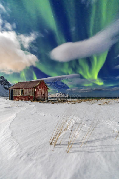 Northern Lights Over An Abandoned Log Cabin Surrounded By Snow And