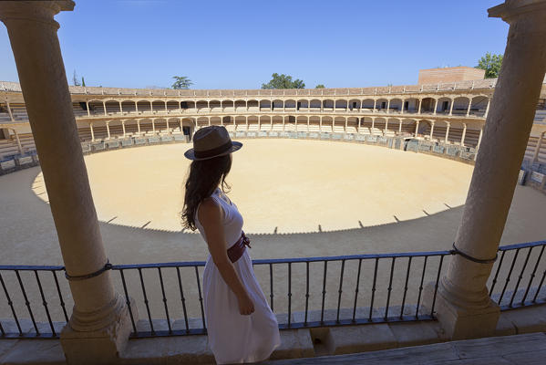 A tourist in the Ronda bullring, Plaza de Toros, Ronda, province of Málaga, Andalusia, Spain