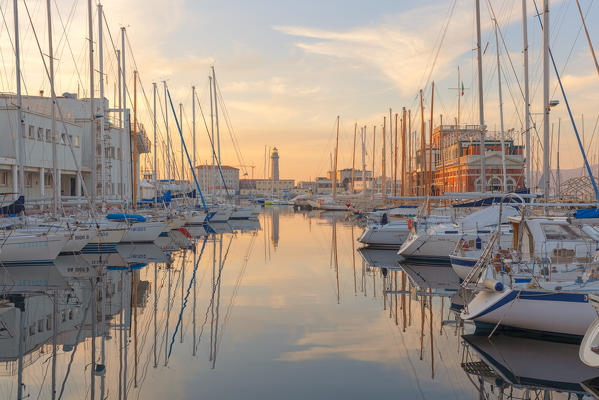 Sunset on the port of Trieste, with the old lighthouse. Trieste, Friuli-Venezia Giulia, Italy