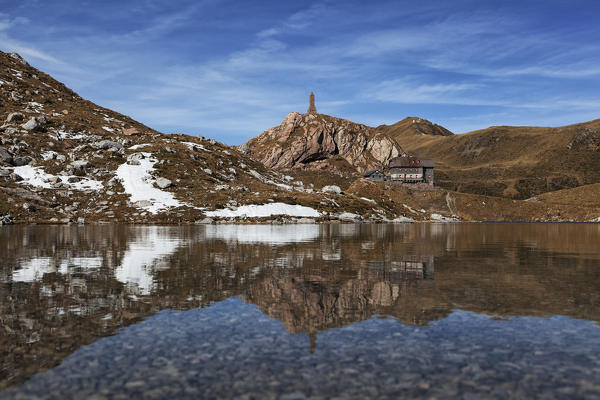 Volaia Lake with the refuge during a autumn day, Carnic Alps, Lesachtal, Carinthia, Austria.