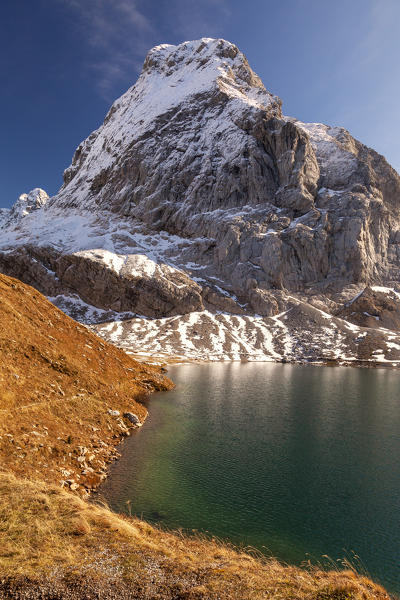 Lastrons del Lago Mount reflected on the waters of Volaia Lake, Carnic Alps, Lesachtal, Carinthia, Austria.