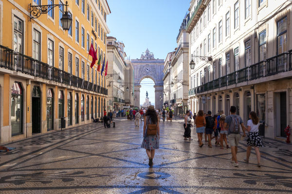 Some tourists walk in Rua Augusta (Augusta Street), Baixa Neighborhood, Lisbon, Lisbon Metropolitan Area, Portugal