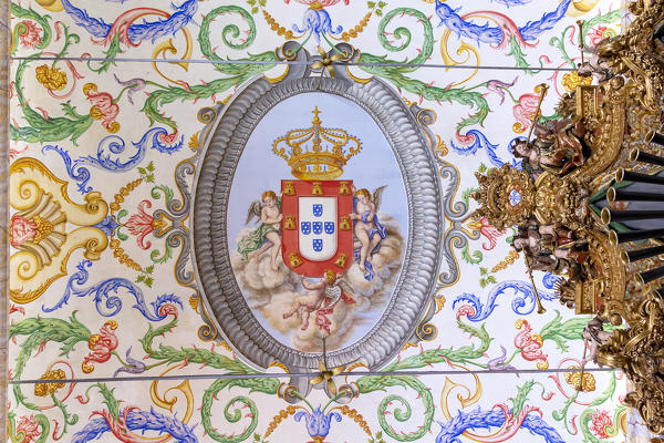 The emblem of University of Coimbra on the decorated ceiling of Capela de São Miguel (Saint Michael's Chapel), Coimbra, Coimbra district, Centro Region, Portugal.
