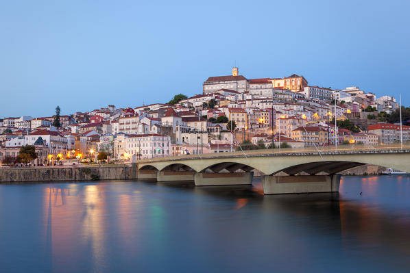 View of Coimbra old town and Santa Clara Bridge at dusk.  Coimbra, Coimbra district, Centro Region, Portugal.